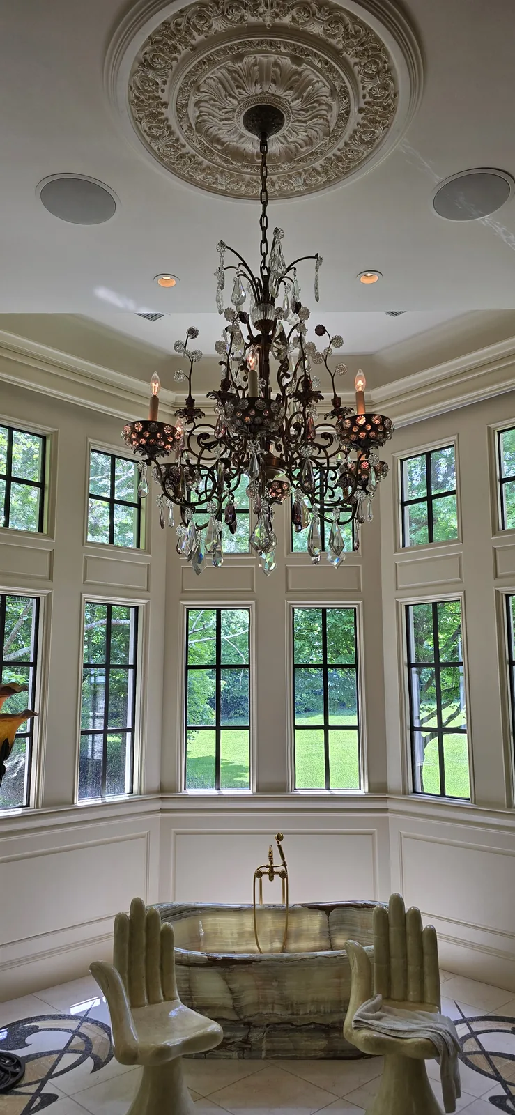 Large ceiling medallion installed with a chandelier in an Atlanta home