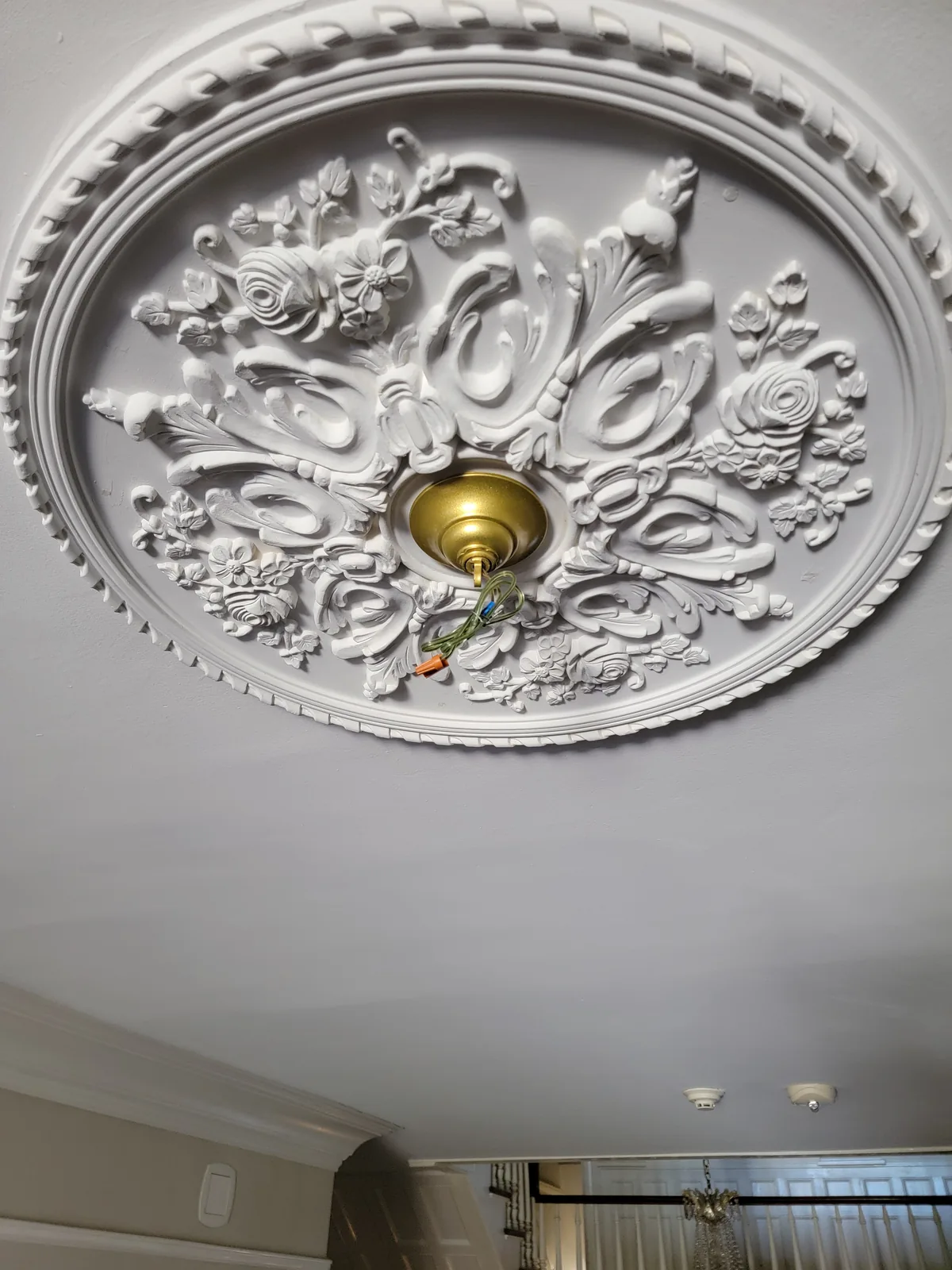 Ornate ceiling medallion installed with chandelier in Atlanta