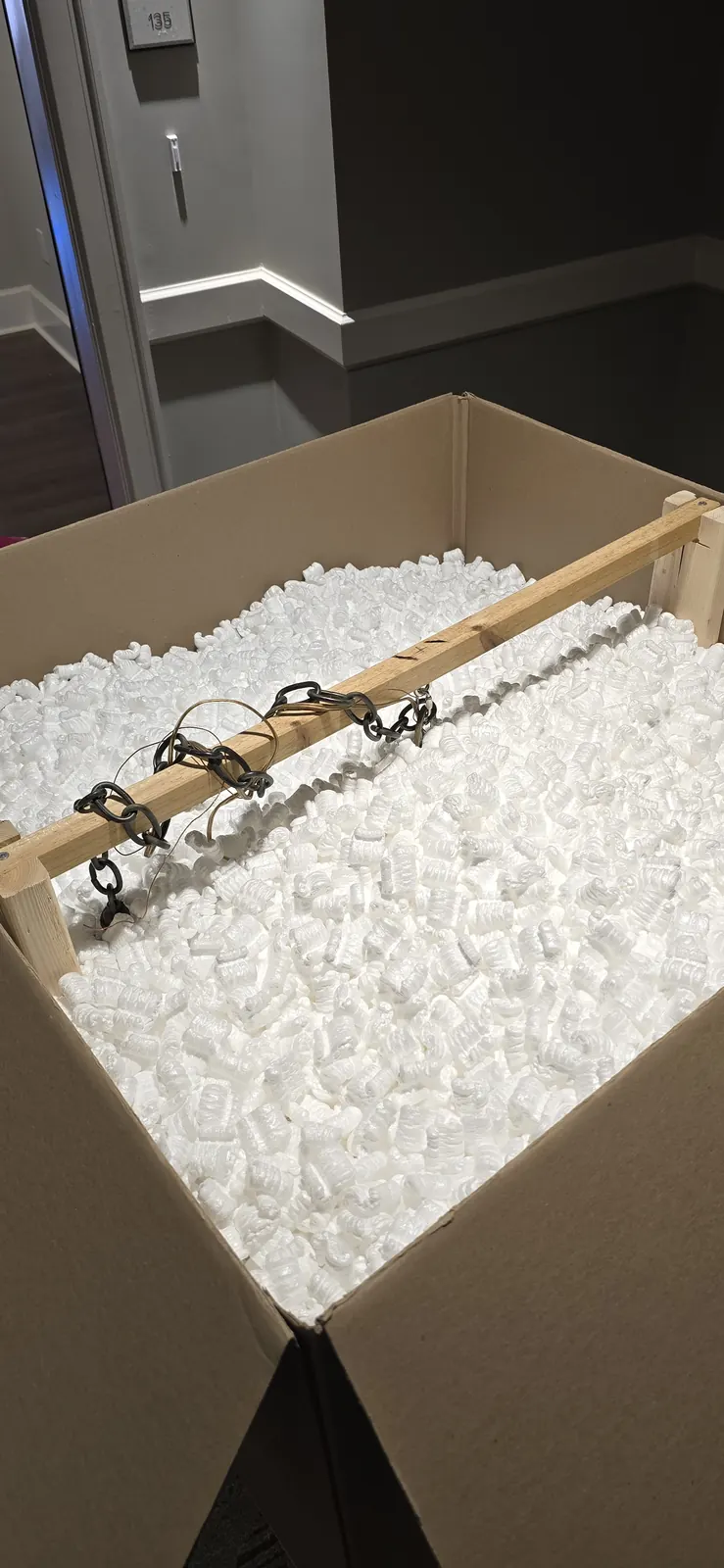 Interior support system inside a custom chandelier crate for safer packing