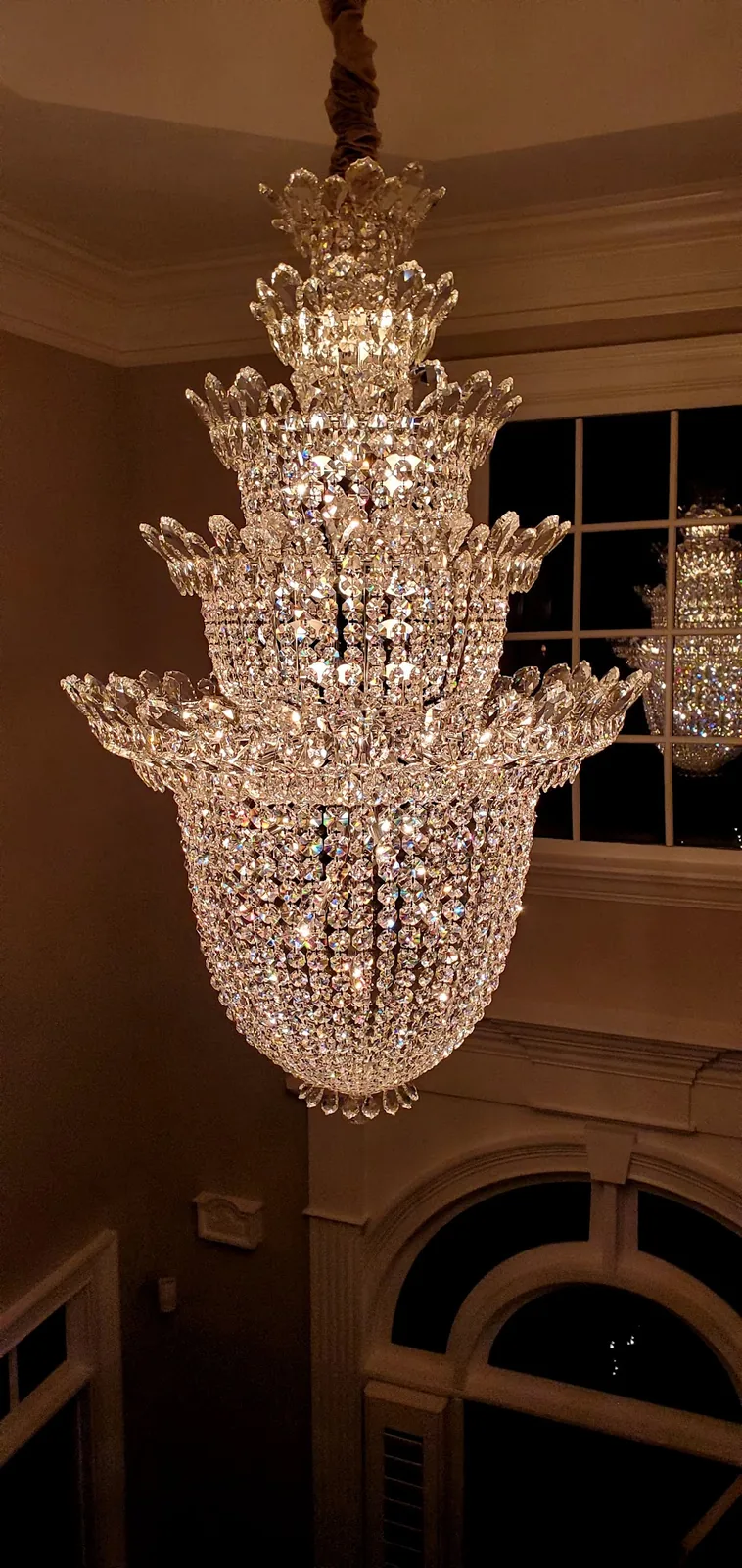 Crystal foyer chandelier installed in an Atlanta entryway