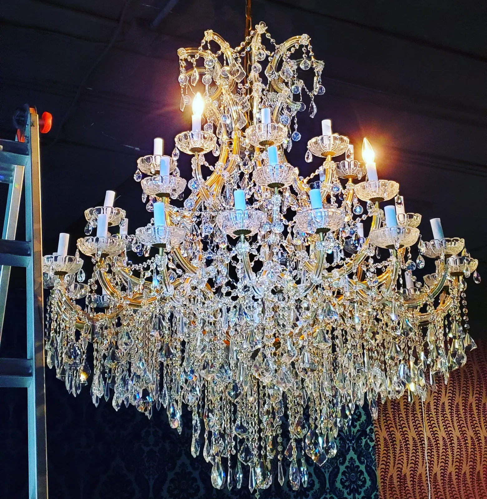 Large crystal chandelier installed in an Atlanta home