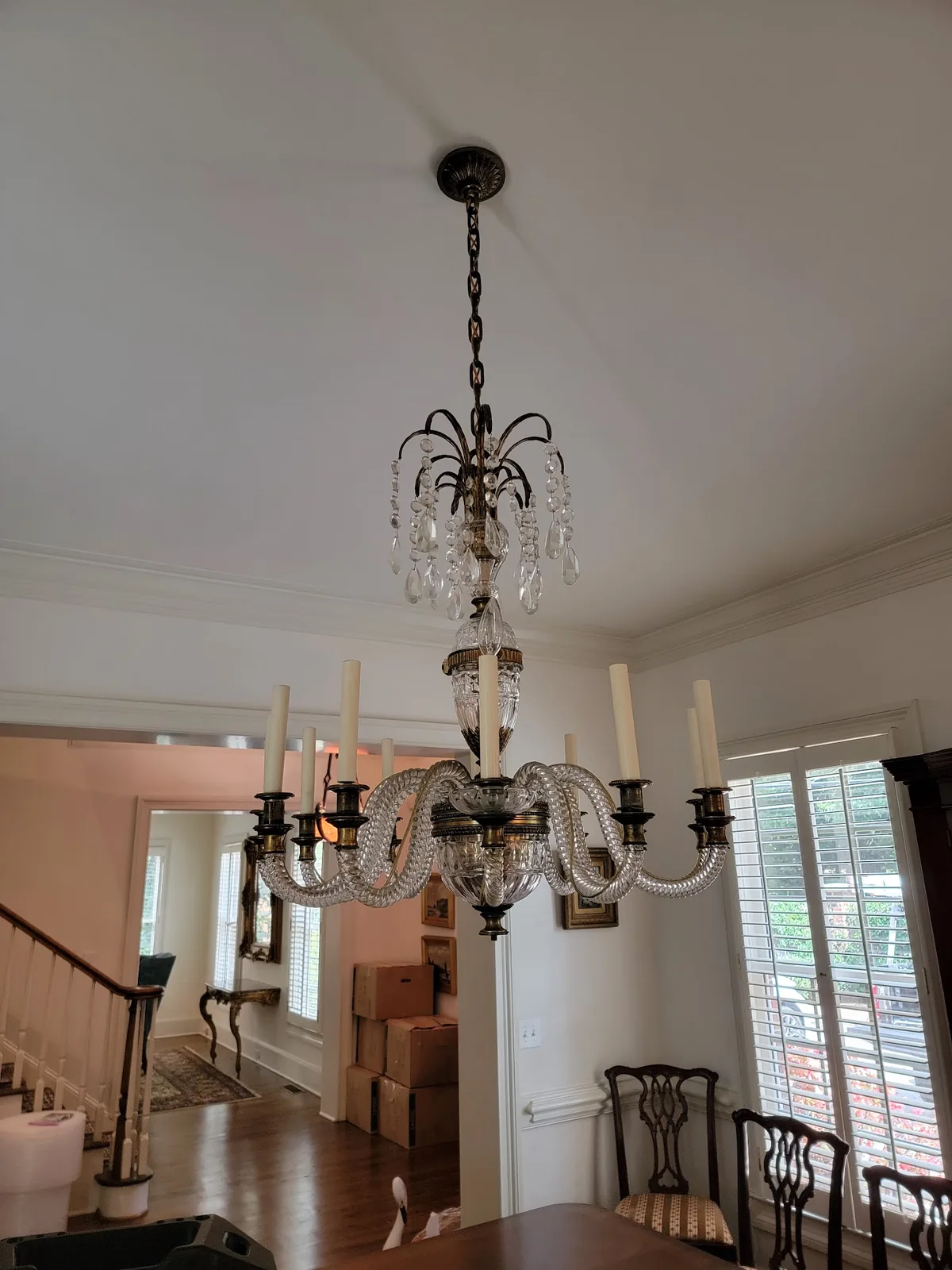 Traditional crystal chandelier installation detail in Atlanta