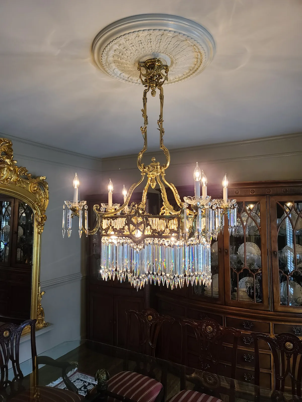Crystal dining room chandelier installed above a dining table in an Atlanta home