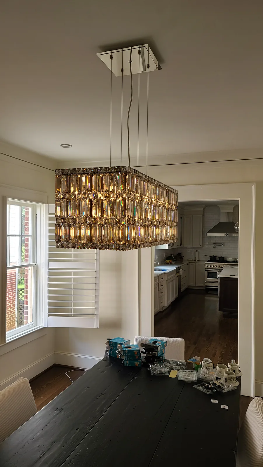 Traditional dining room chandelier installed above a table in an Atlanta home