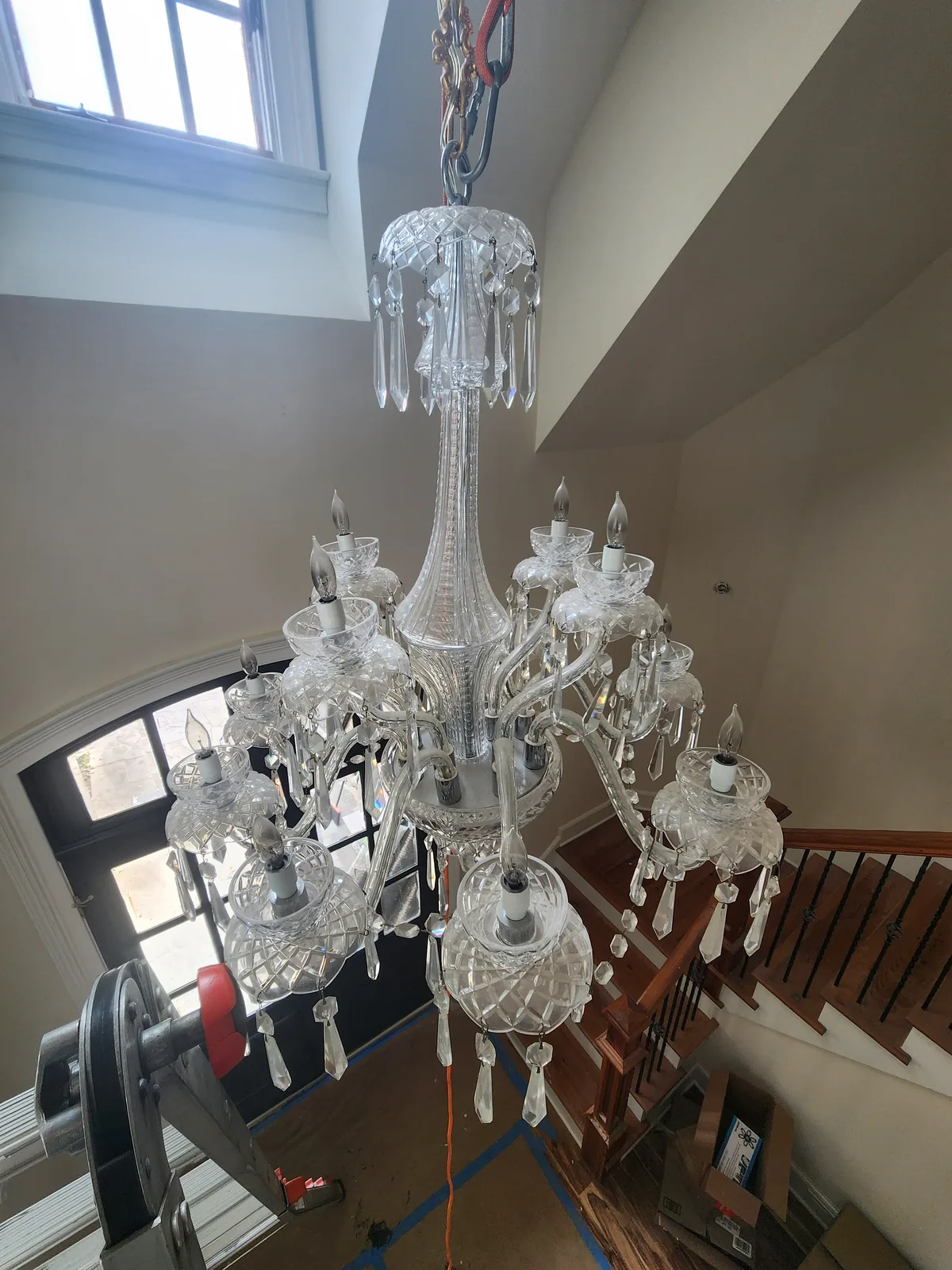 Large chandelier installed in an Atlanta entry foyer