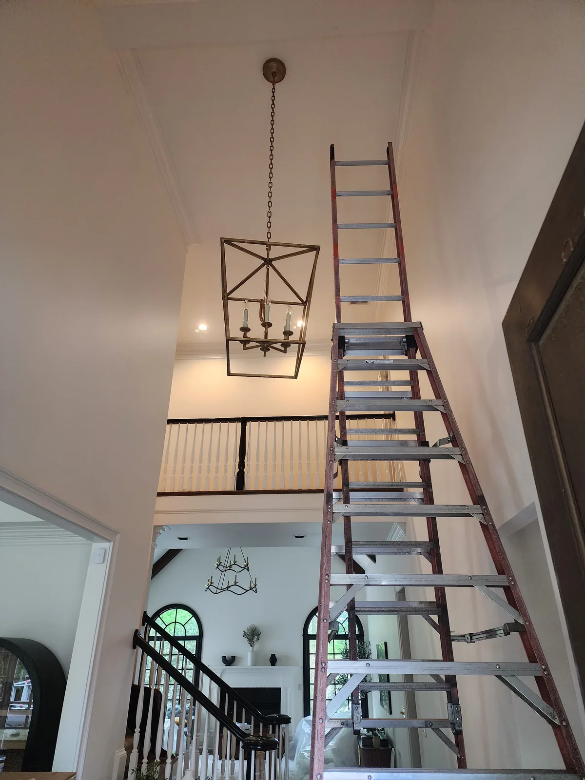 Large foyer chandelier installed in an Atlanta entry hall
