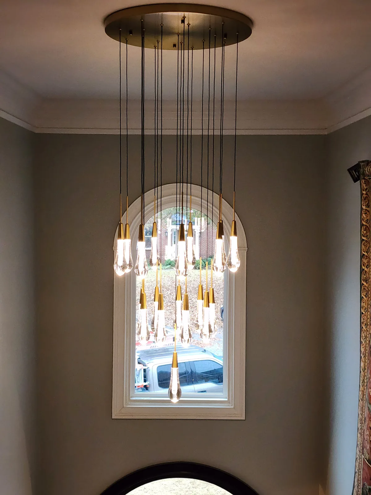 Modern entryway chandelier installed in an Atlanta home