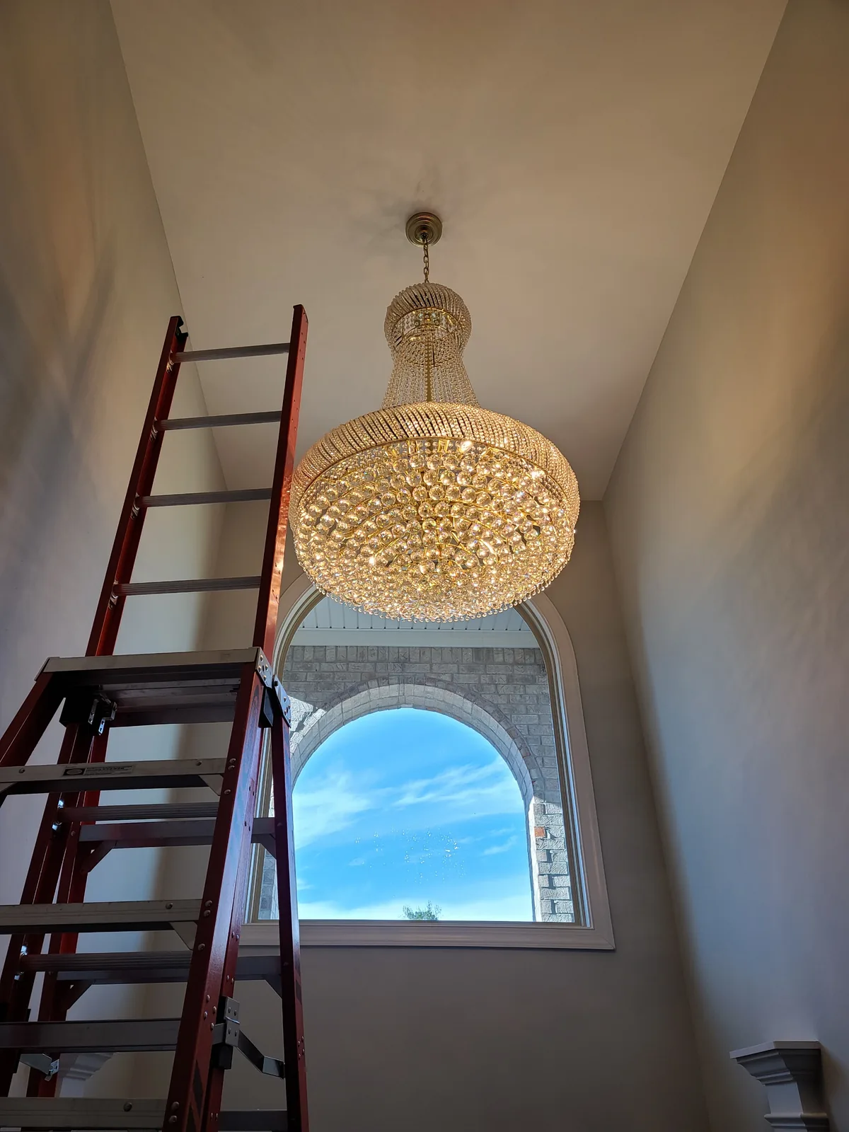 Traditional chandelier installed in an Atlanta entryway