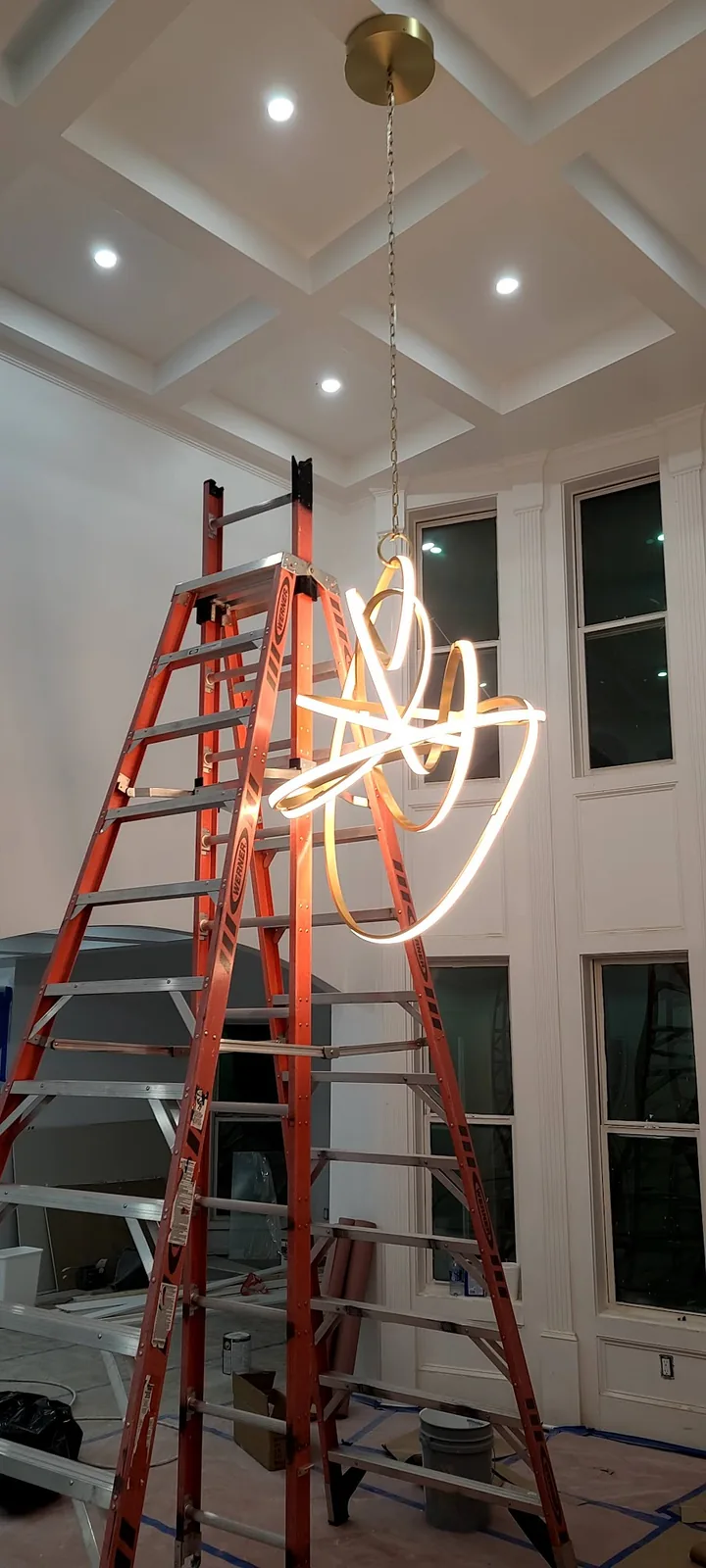 Contemporary two-story light fixture installed in an Atlanta home