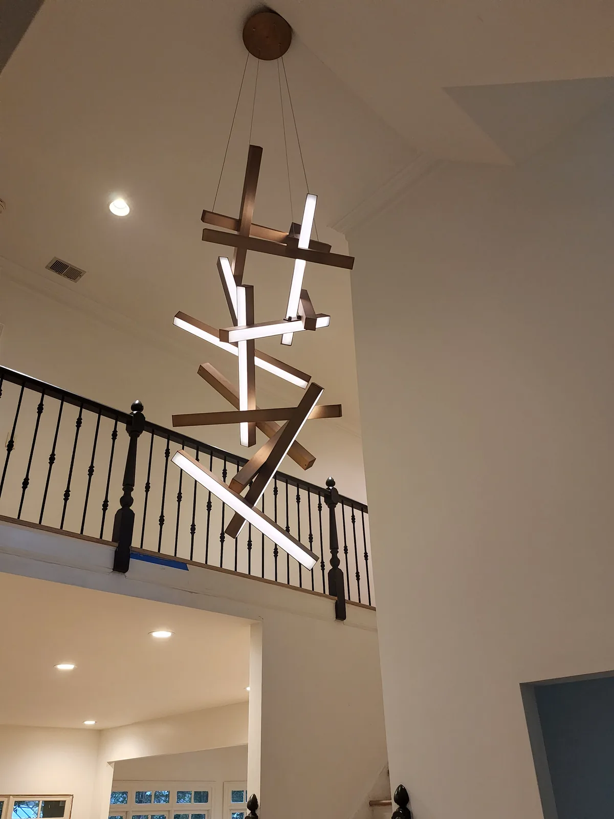 Large modern chandelier installed in an Atlanta home