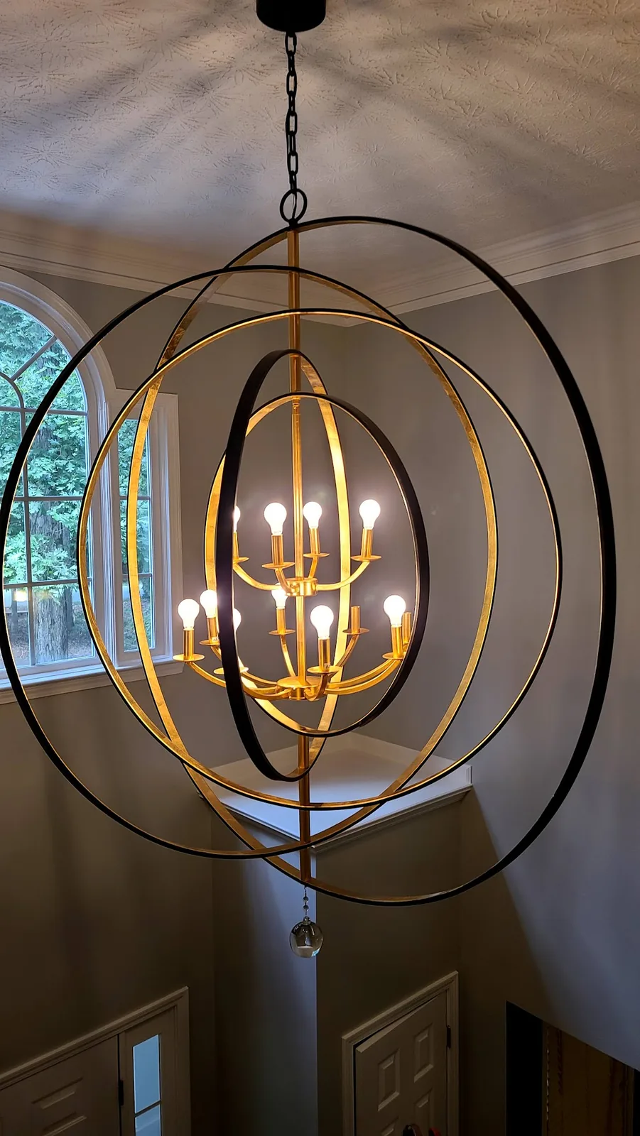 Antique metal chandelier installed in an Atlanta home