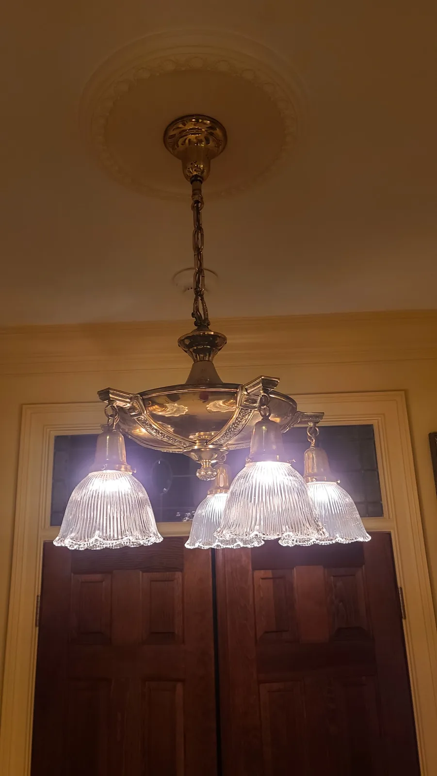 Traditional brass chandelier installed in an Atlanta residential interior