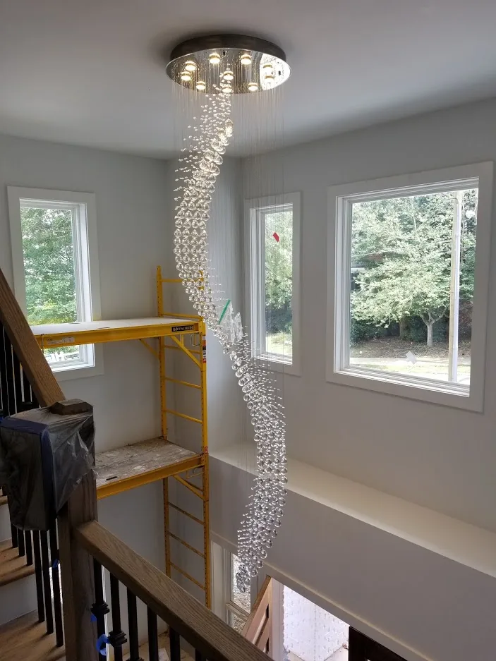 Large crystal suspension chandelier installed in an Atlanta home