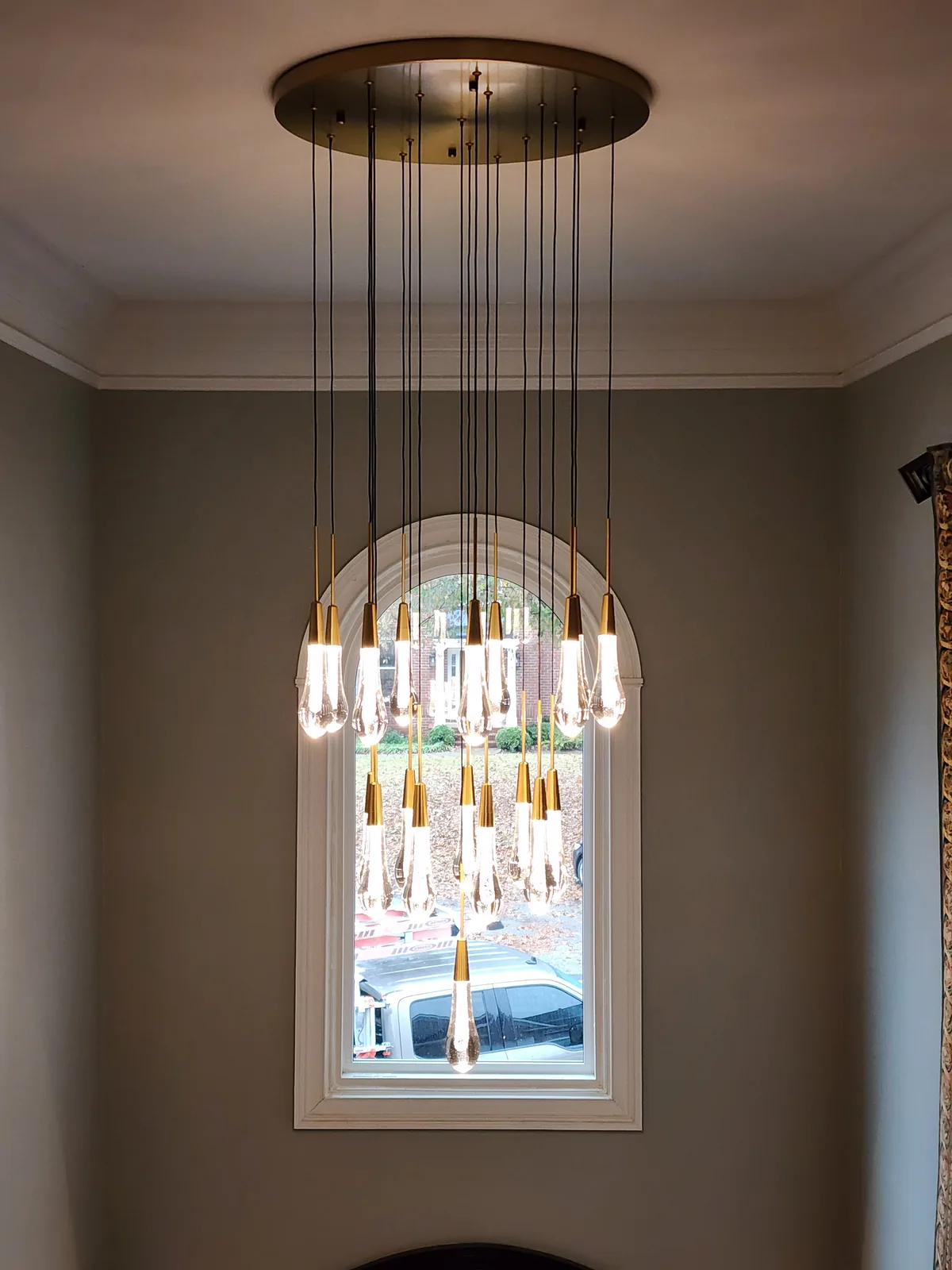 Modern multi-light suspension chandelier installed in an Atlanta home