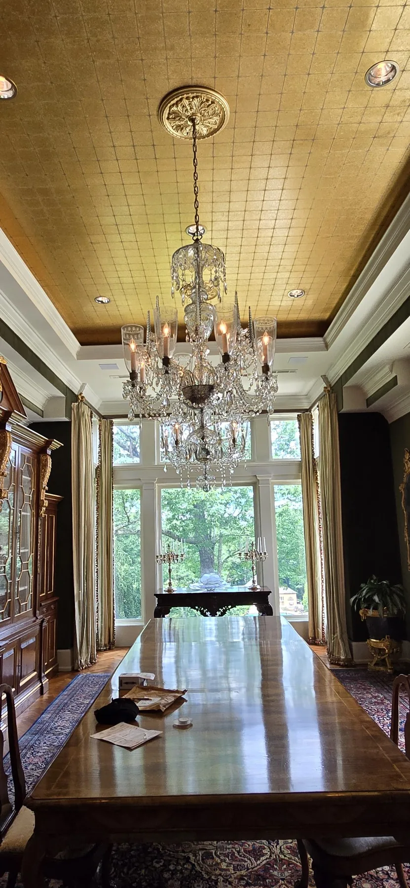 Matching traditional antique chandelier installed in an Atlanta home