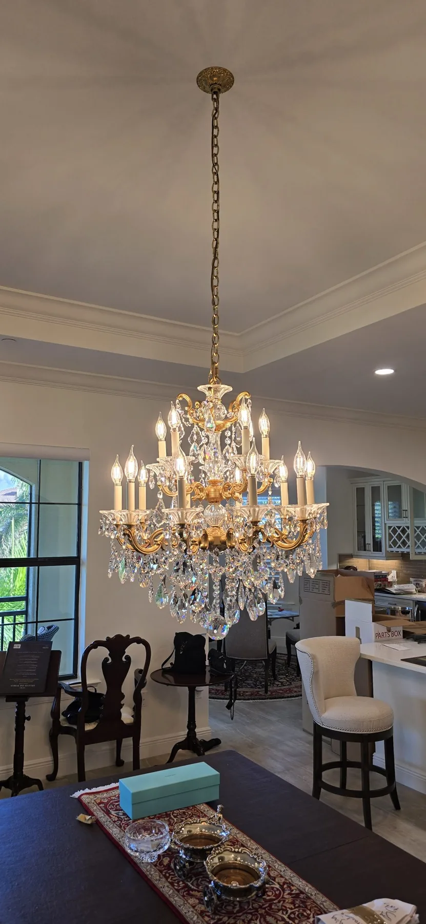 Traditional Schonbek chandelier installed in a formal interior