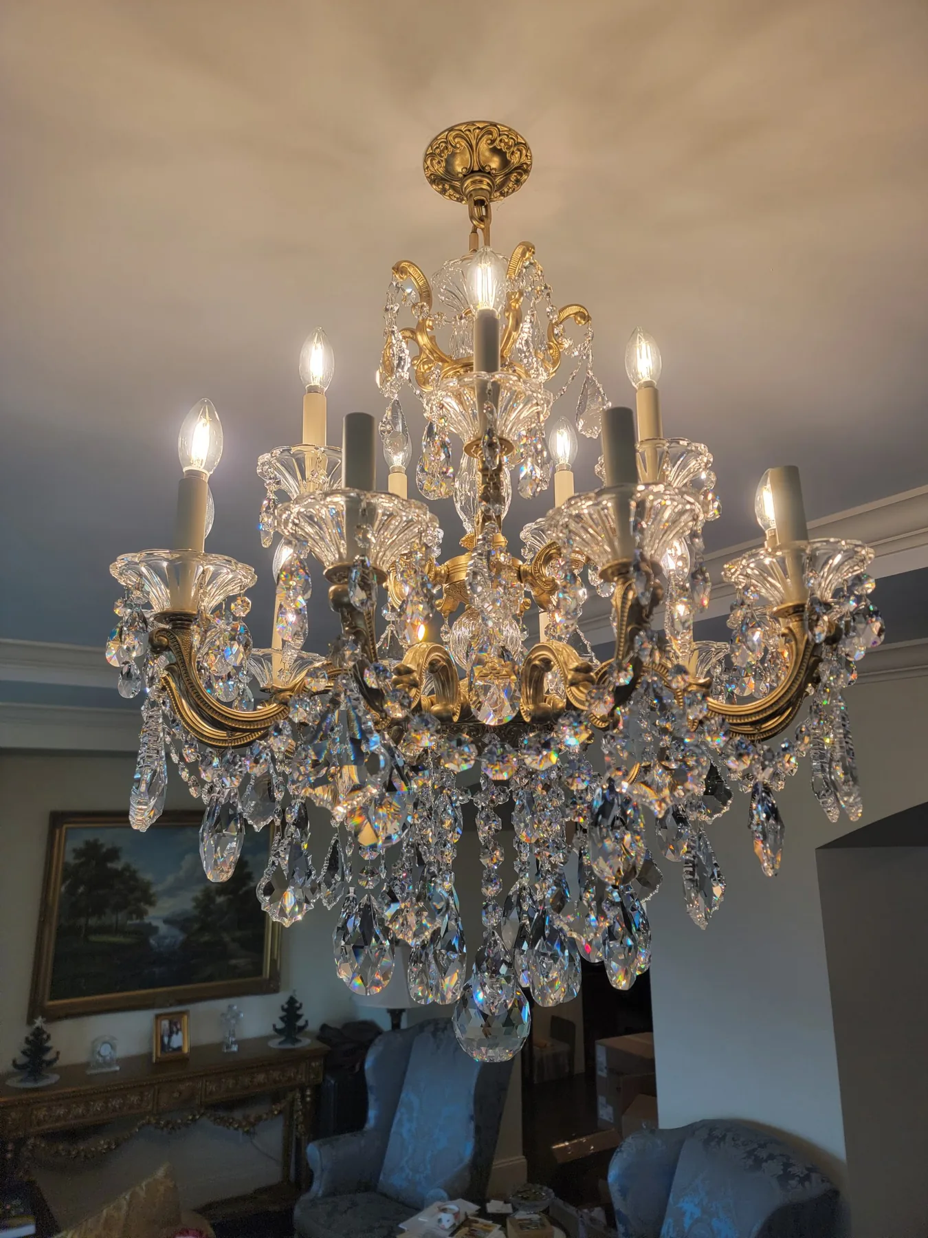 Schonbek crystal and brass chandelier installed in an Atlanta home