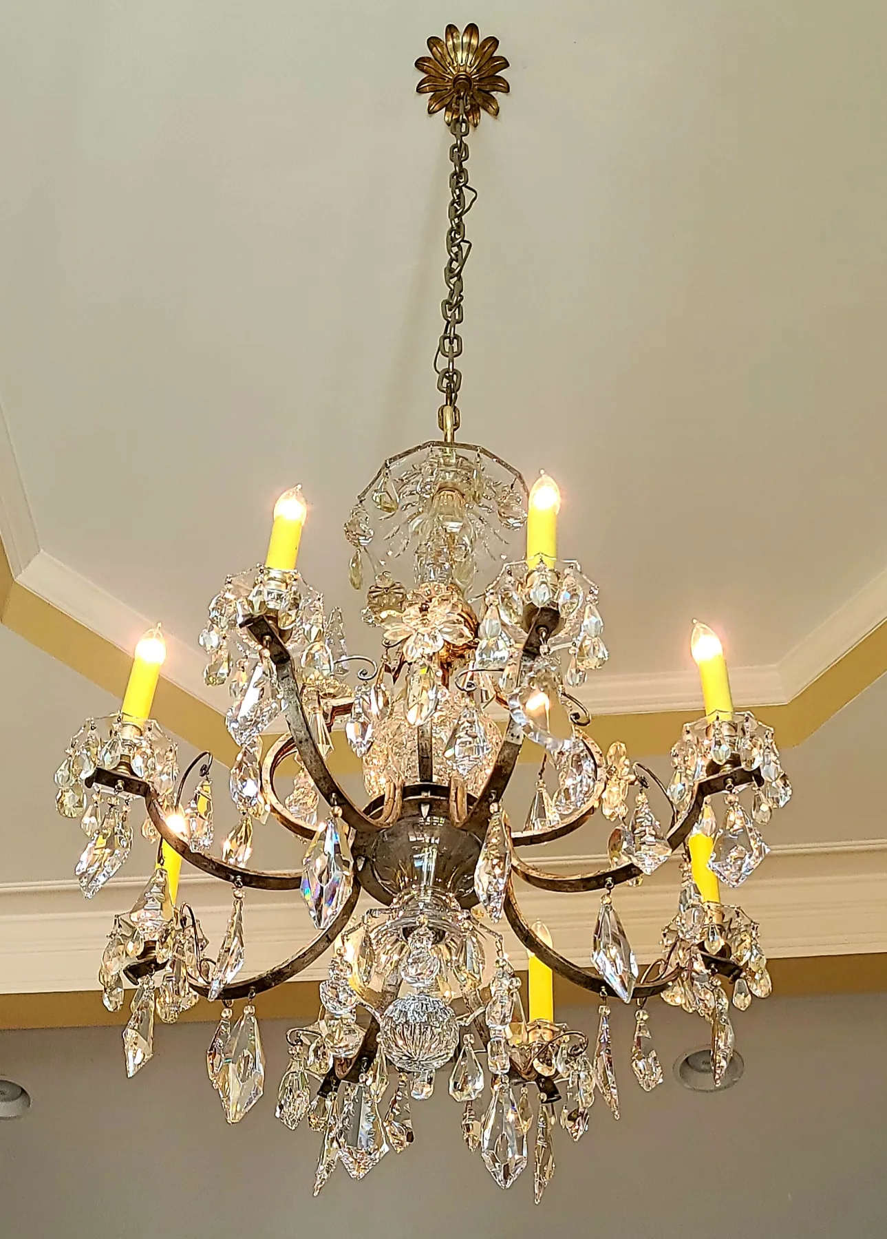 Traditional brass and crystal chandelier installed in an Atlanta home