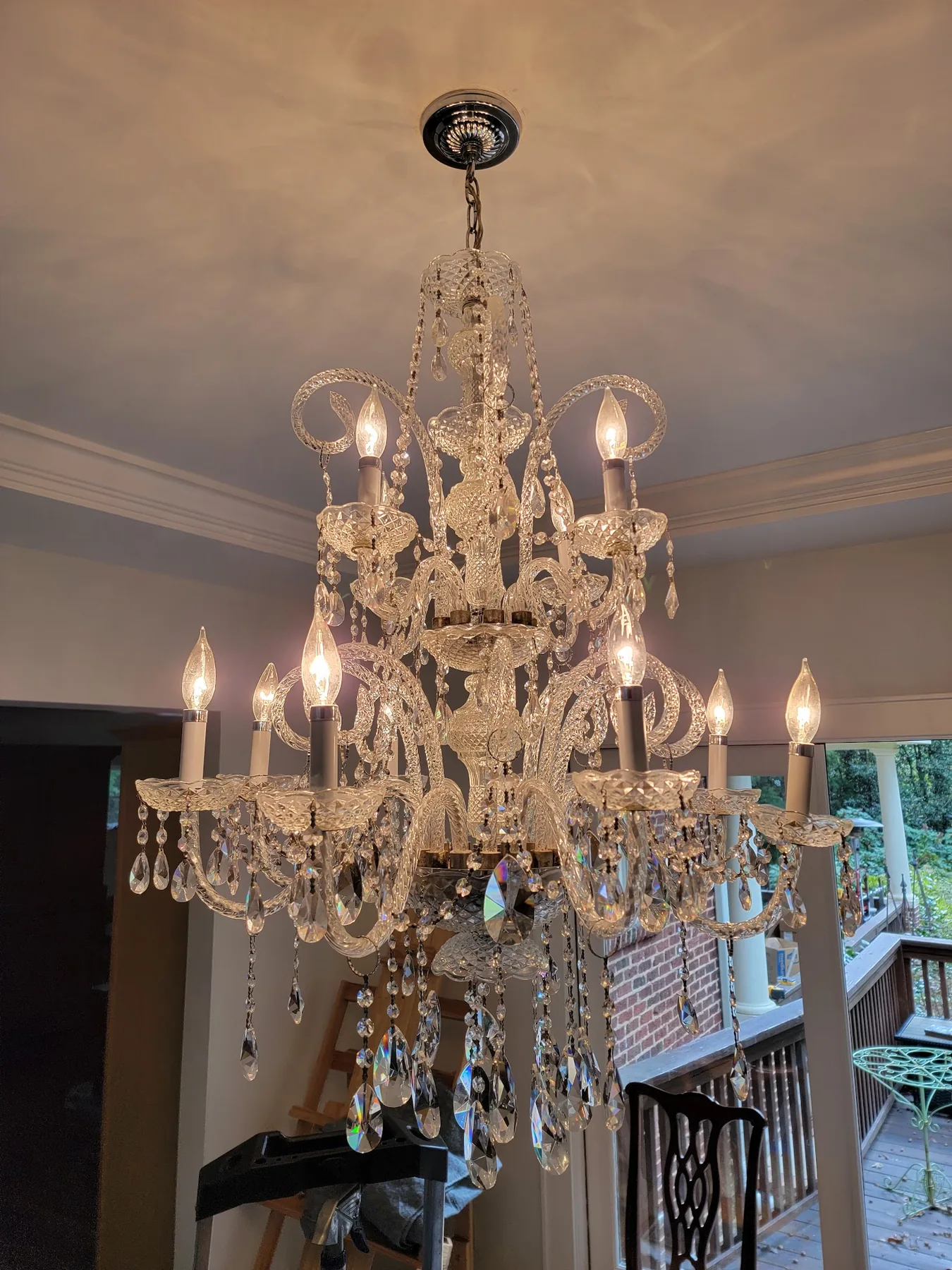 Traditional crystal chandelier installed over a dining area in Atlanta