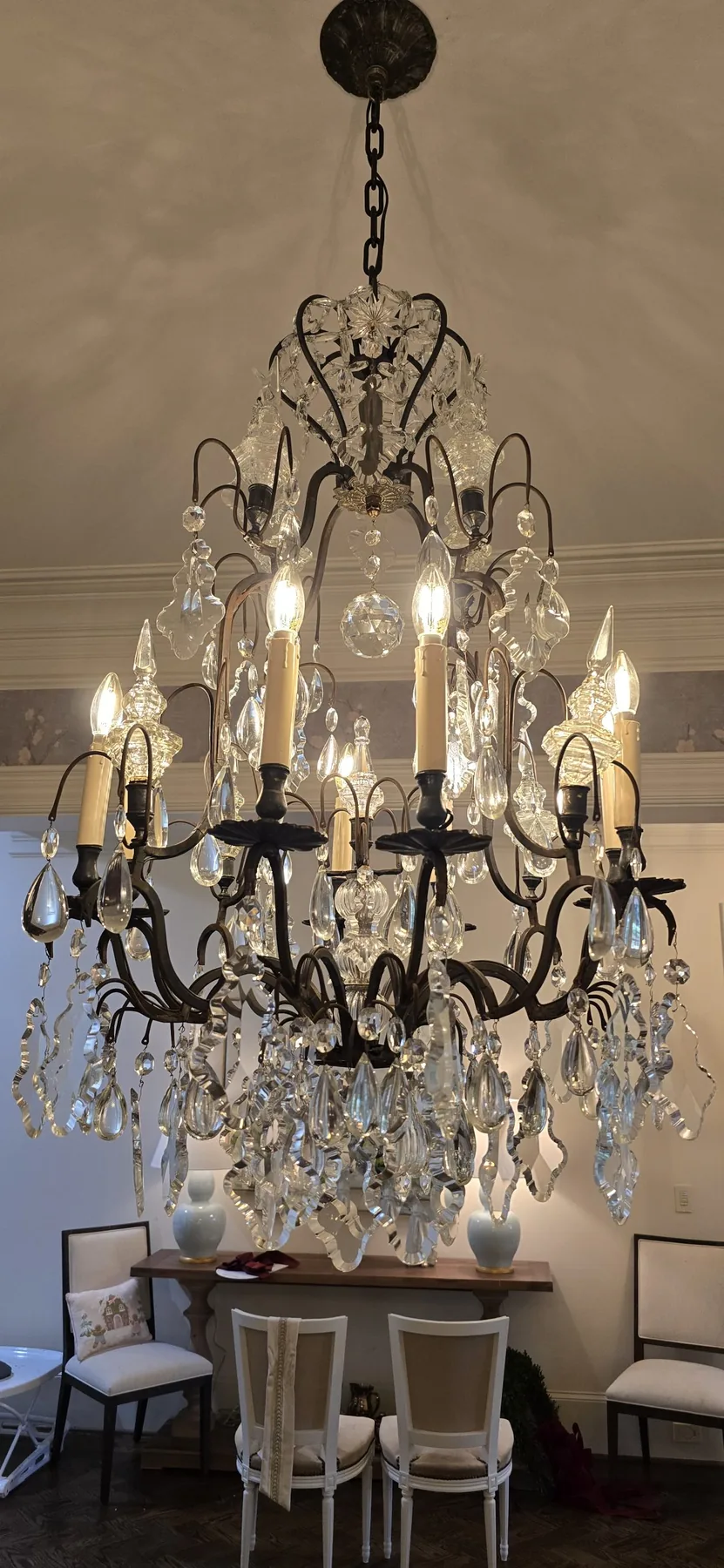 Traditional metal and crystal eight-light chandelier installed in Atlanta