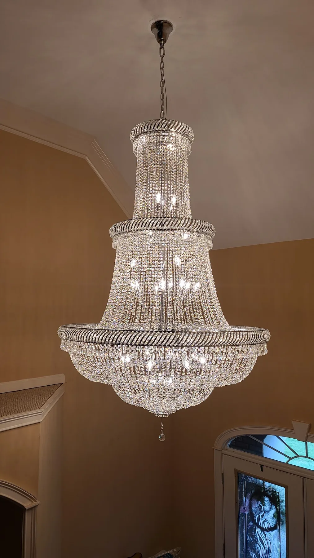 Traditional tiered crystal chandelier installed in an Atlanta home